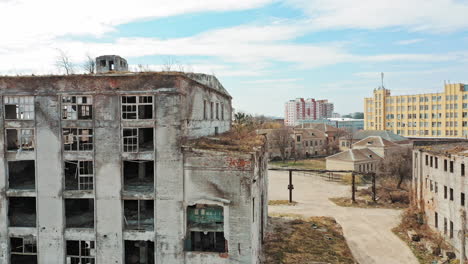 old abandoned apartment buildings. broken windows in old abandoned industrial building