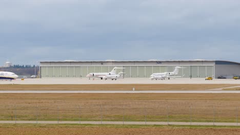 ryanair and private jet at airport hangar