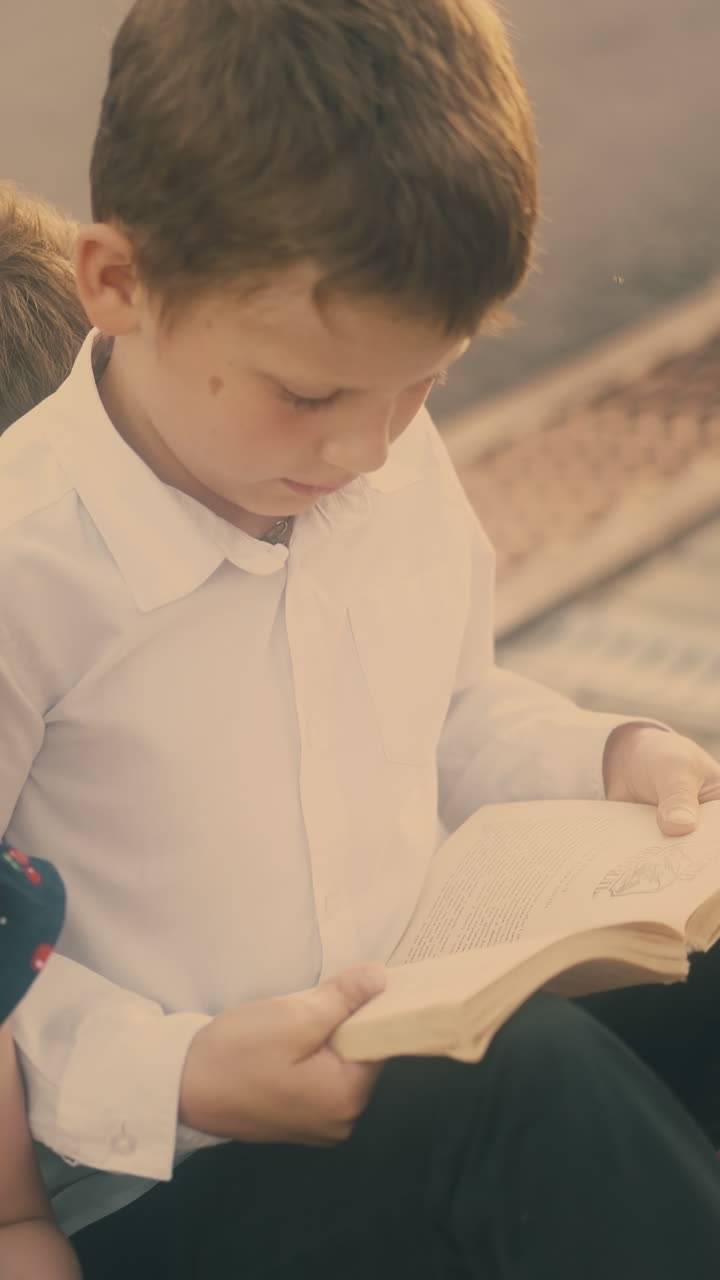 little blonde girl in black dress talks to schoolmates during preparation for difficult exams close view