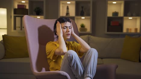 desperate young woman with her hands on her head. depressed.