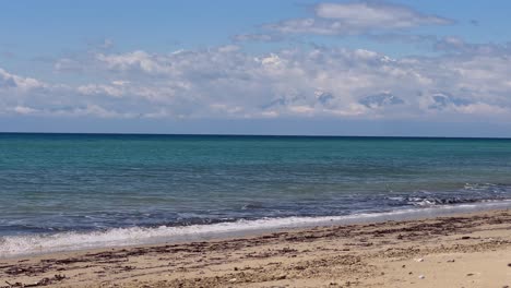 Stunning beach scene in Halkidiki, Greece, with elegant sunbeds facing the crystal-clear turquoise sea. A perfect summer escape in the heart of the Aegean.