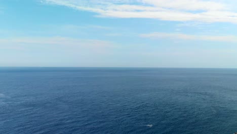 aerial: drone descanding above the tyrrhenian sea in scilla , italy