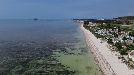 beautiful aerial drone footage of my hoa lagoon with calm waters and lush tropical surroundings in vietnam, perfect for travel and nature themes