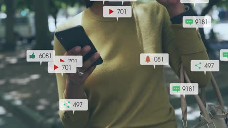 animación de iconos de los medios sobre una mujer biracial usando un teléfono inteligente