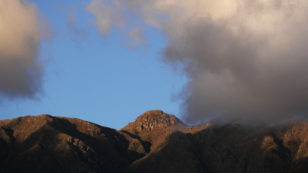 Beautiful clouds at sunset over the mountains in Argentina. Cordoba province, Comechingones mountain range. Time-lapse video in 4k.