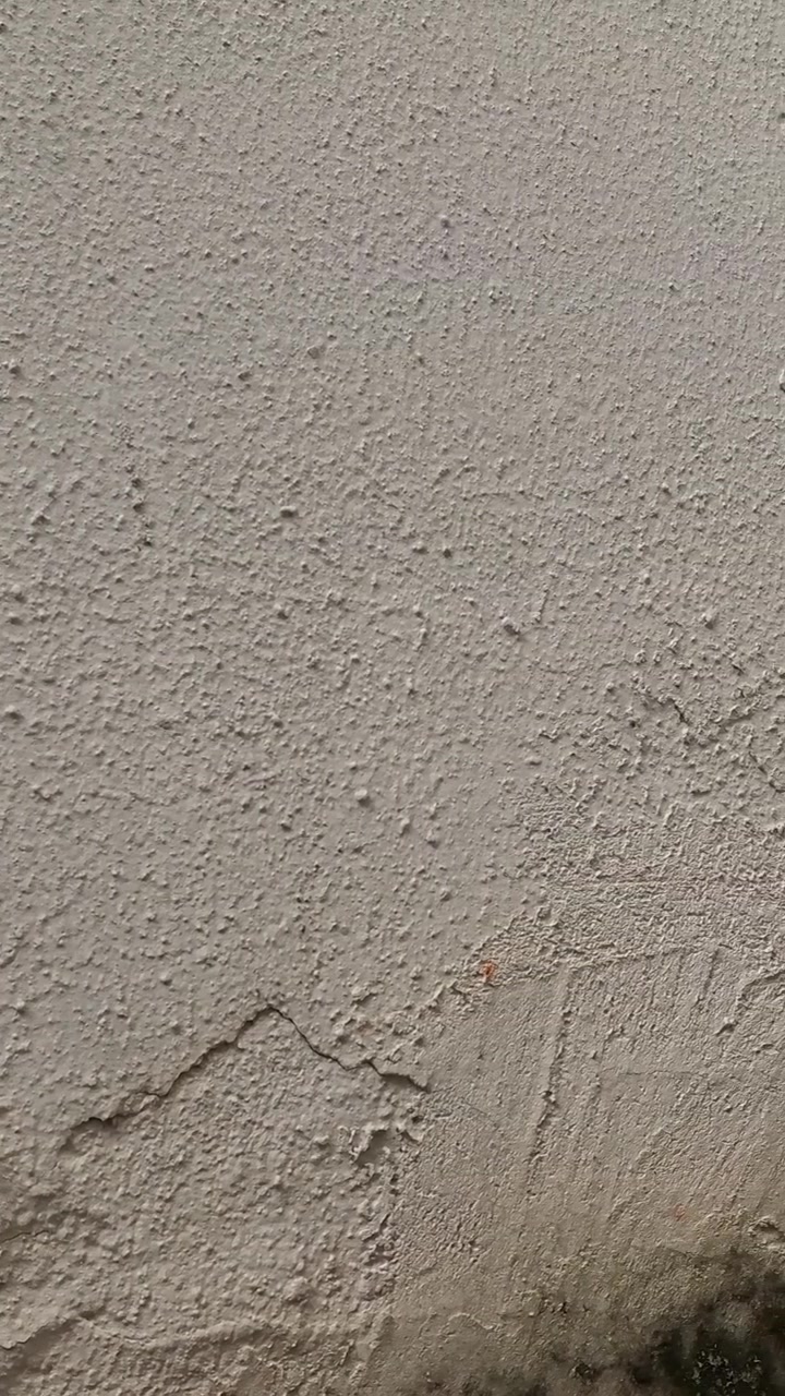 Close-up of Textured Concrete Wall with Weathered Surface