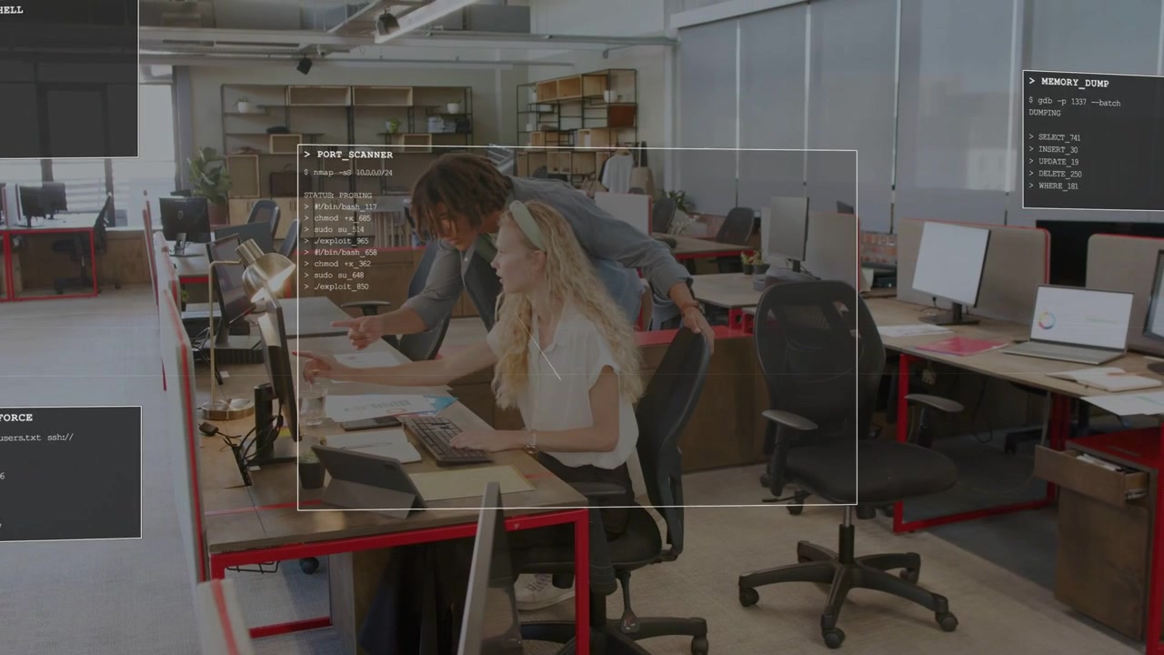 Man walking assisting woman typing in office, leaning, pointing at monitor HUD highlighting entries
