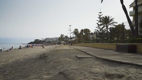 the boardwalk on the beach at cala de mijas on a lazy sunny afternoon
