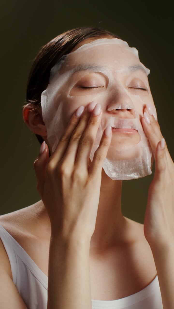 Woman Applying a Sheet Face Mask