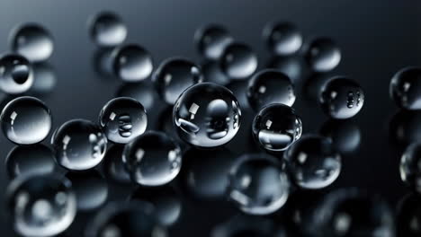 clear spheres with reflections on dark surface