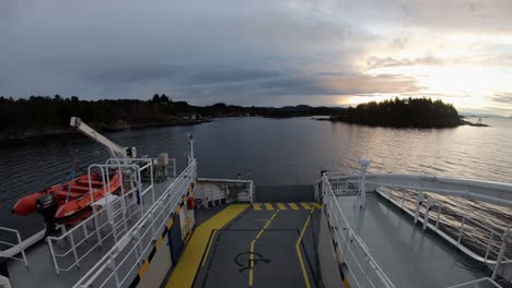 timelapse of electric norwegian car ferry sailing narrow waters at dawn sunset