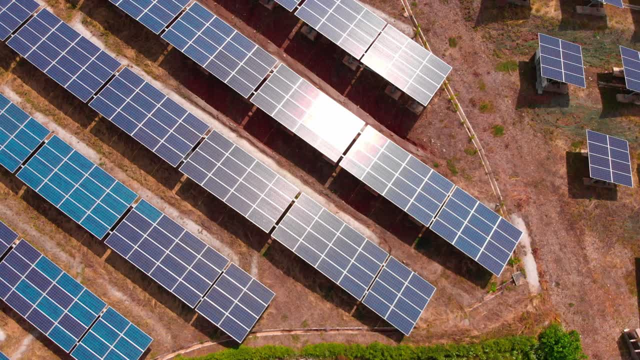 Bird's view above solar panels and asian traditional house