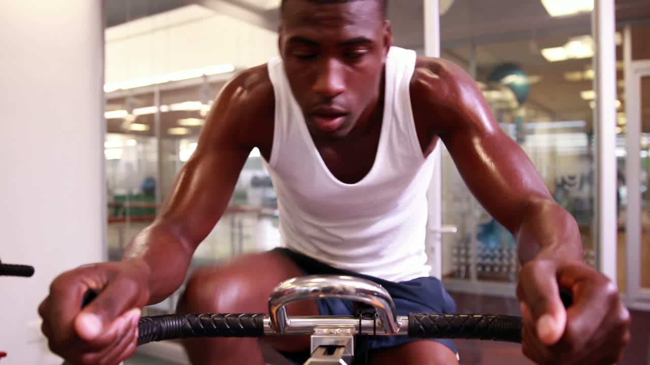 Fit man working out on the exercise bike