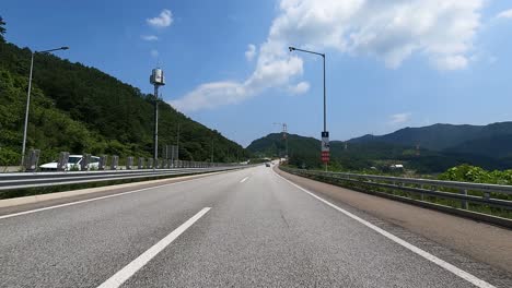 driving through country asphalt road near seoraksan national park in sokcho, south korea