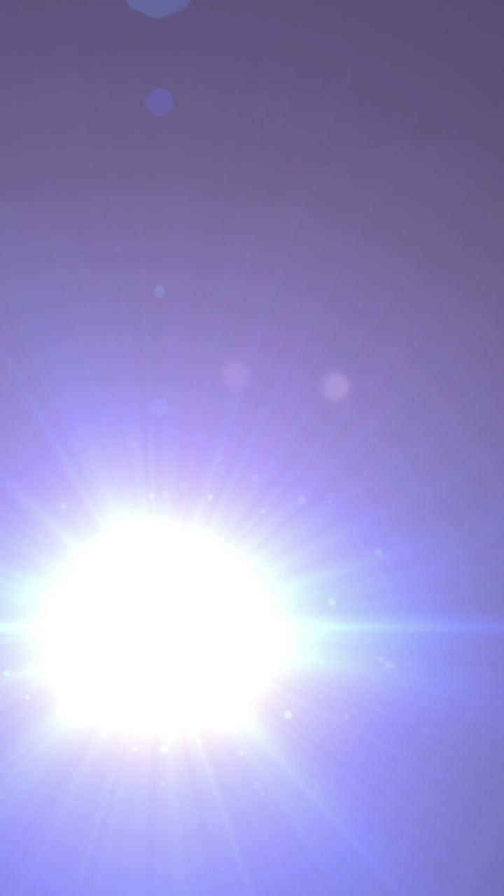 Animación de un foco con efecto flare sobre un fondo oscuro.