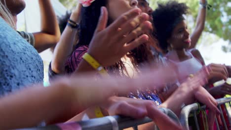 Group-of-friends-dancing-at-music-festival-4k