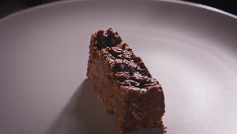 spinning plate with a delicious piece of chocolate oat cake - steady shot