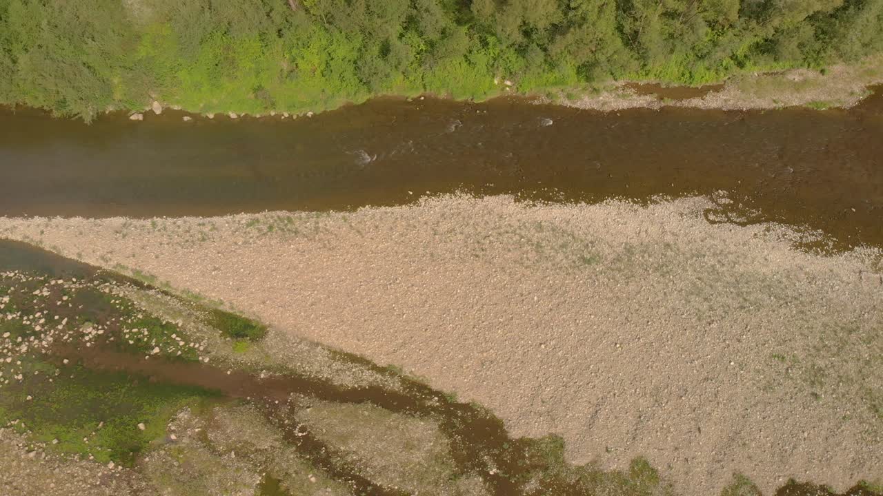 Aerial pan over drying up riverbed in Europe