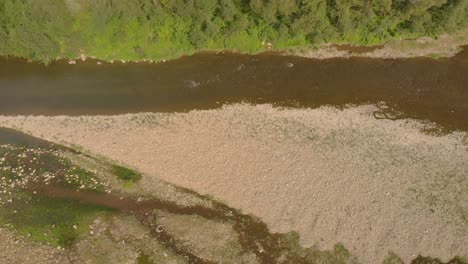 aerial pan over drying up riverbed in europe