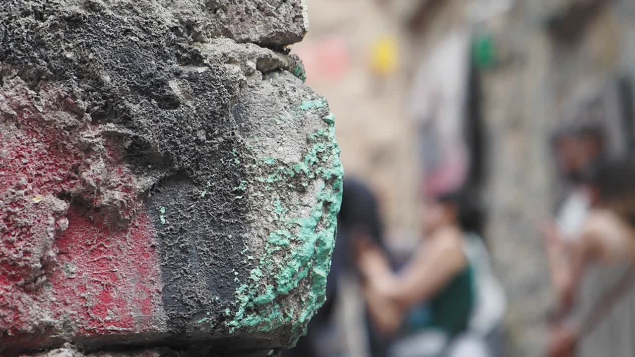 Graffiti-covered urban wall with blurred background