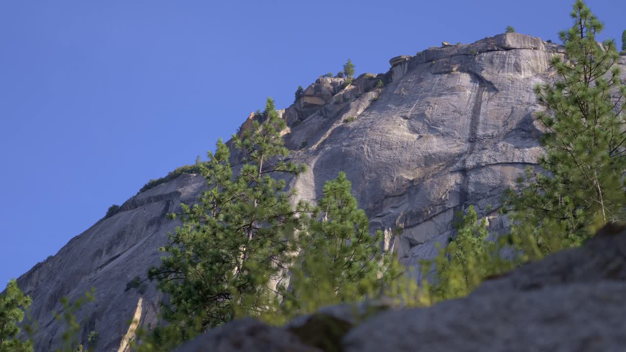 4K slider clip travels sideways while looking steeply upward at a sheer Yosemite granite wall