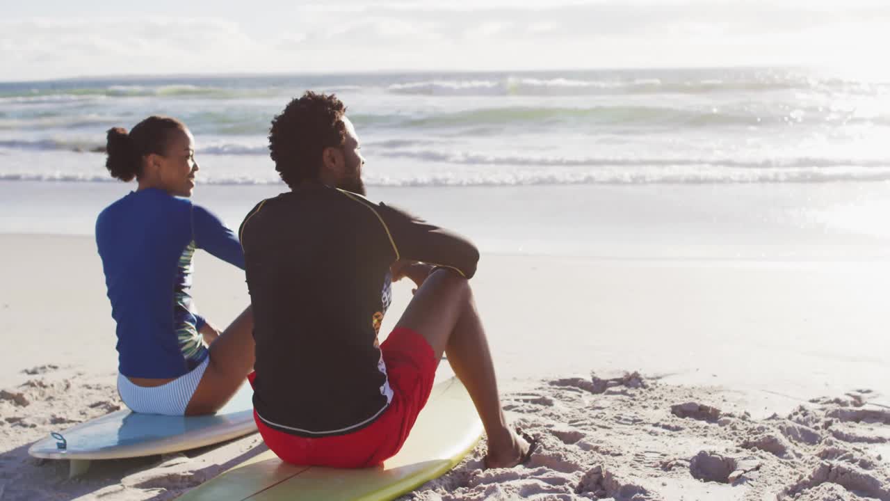 Surfers on boards talking beach gesturing starting animated social media likes showing engagement
