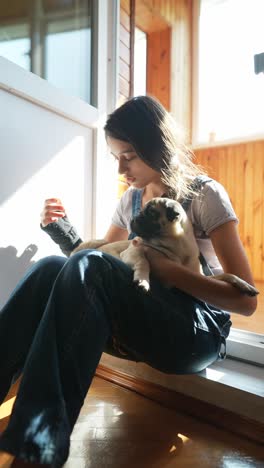 girl hugging a pug