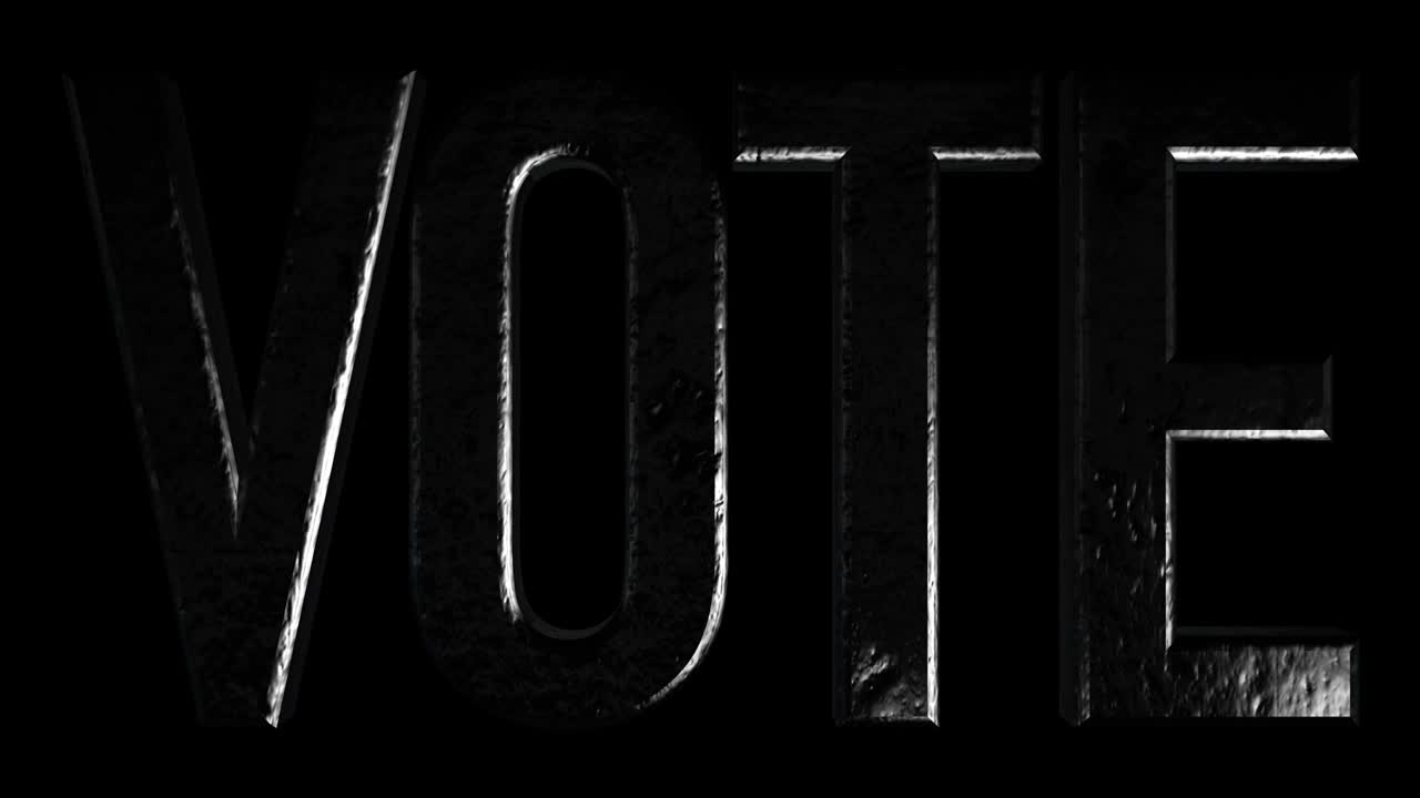 Scritta - Vota. Su sfondo nero con bagliori e luce.