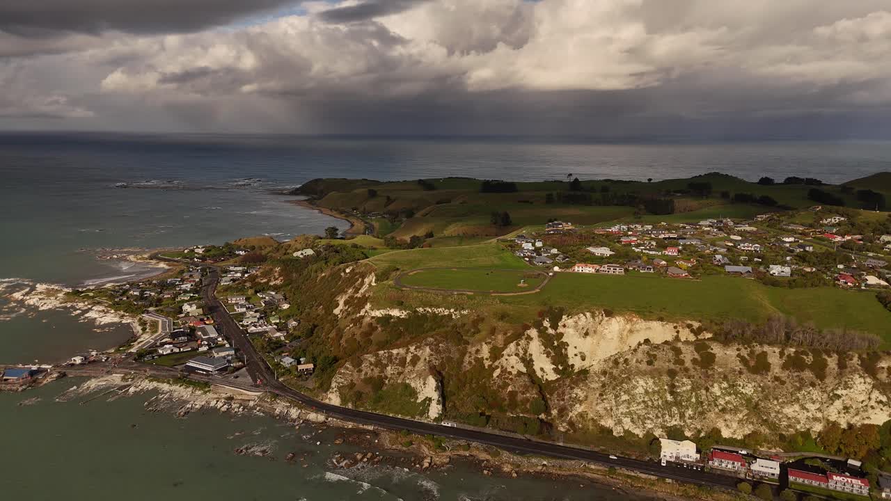 Breathtaking 4K drone footage captures a stunning view of the Kaikoura Peninsula in New Zealand's South Island, showcasing its rugged coastline, mountains, and marine-rich waters