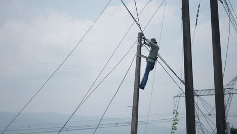 worker repairing power lines