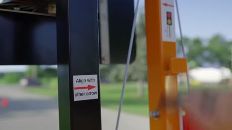 a mobile construction stop light is cranked into position