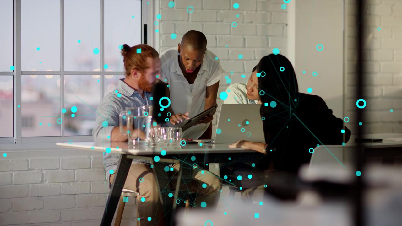 Business lead entering while sharing tablet team leaning to laptop while teal overlay guiding focus