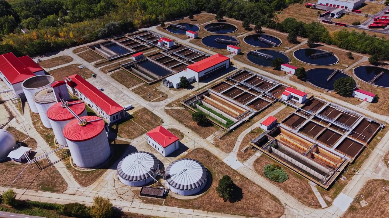Water treatment facility located near a highway with multiple tanks