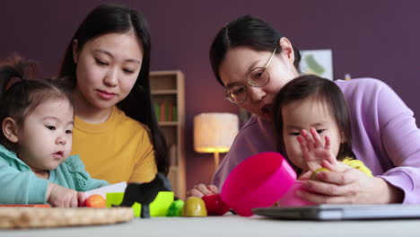 mothers and babies in living room