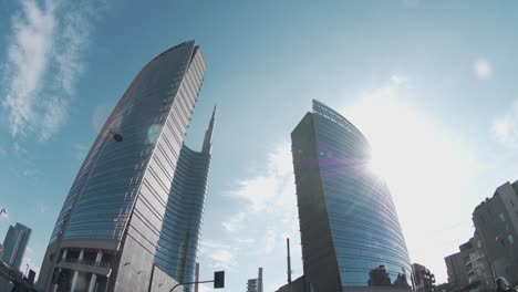 milan city curved glass buildings in modern downtown business square. italy