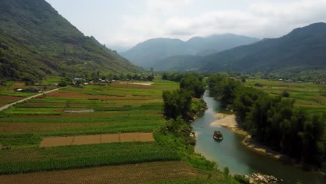 Terraced-fields-of-crops,-idyllic-river-water-and-beautiful-mountainous-landscapes
