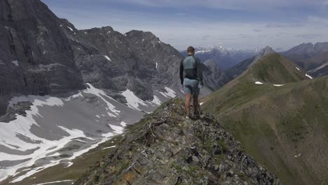 hiker on mountain ridge walking followed rockies kananaskis alberta canada