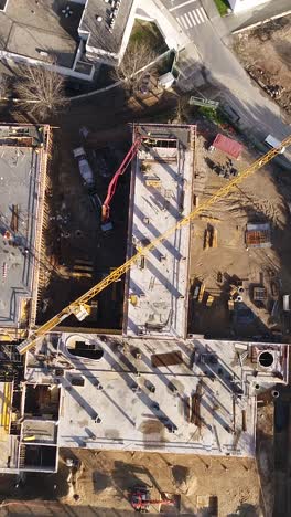 vertical video construction site workers in action top view