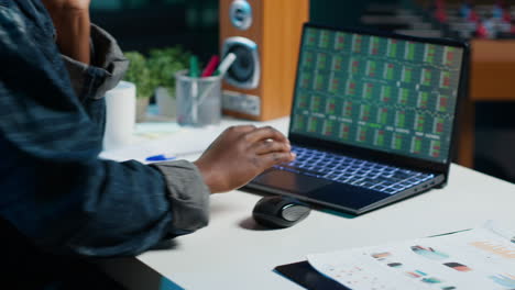 person working on laptop at night