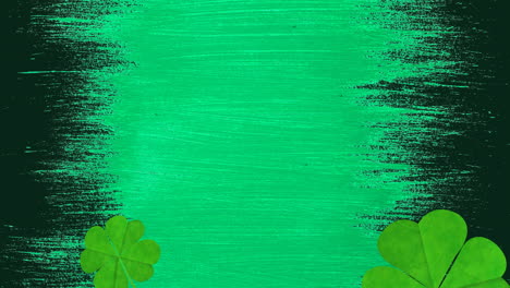 animación de varias hojas de trébol que caen sobre un fondo verde y negro