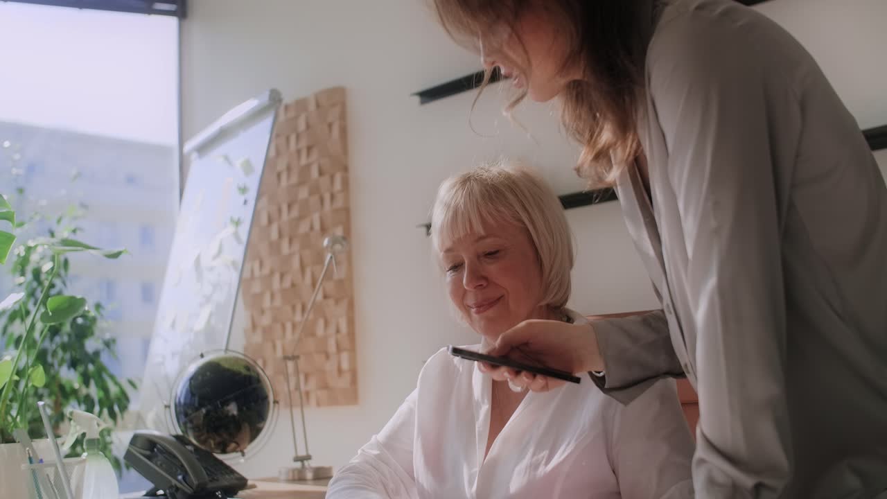 Two women in an office setting