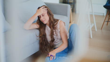 Pensive-Female-Student-Closing-Book