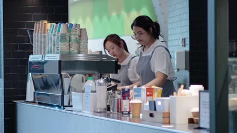 cafe staff preparing and serving drinks