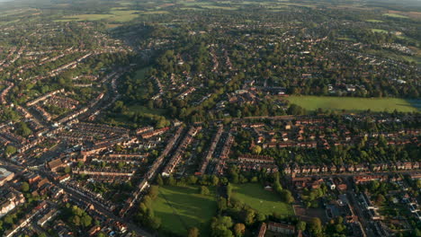 descending aerial shot over sprawling residential housing uk