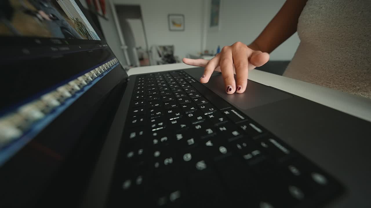 Close-up of a person using a laptop