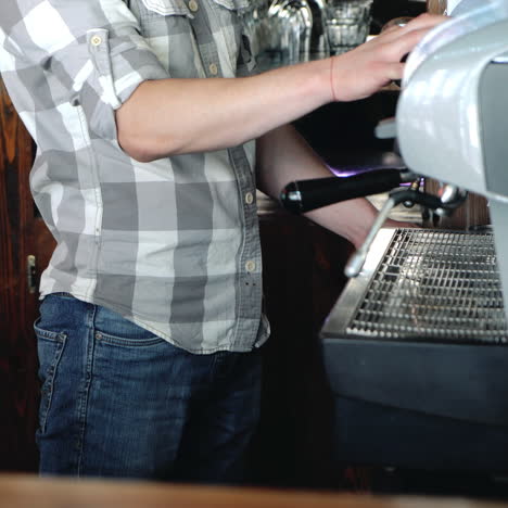 barista making coffee in the coffee machine. sqare video