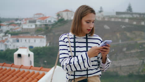 beautiful tourist taking pictures on european trip. girl exploring old town