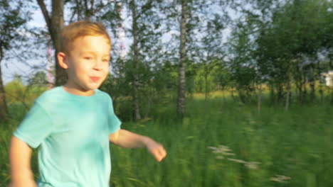 little boy running on country road