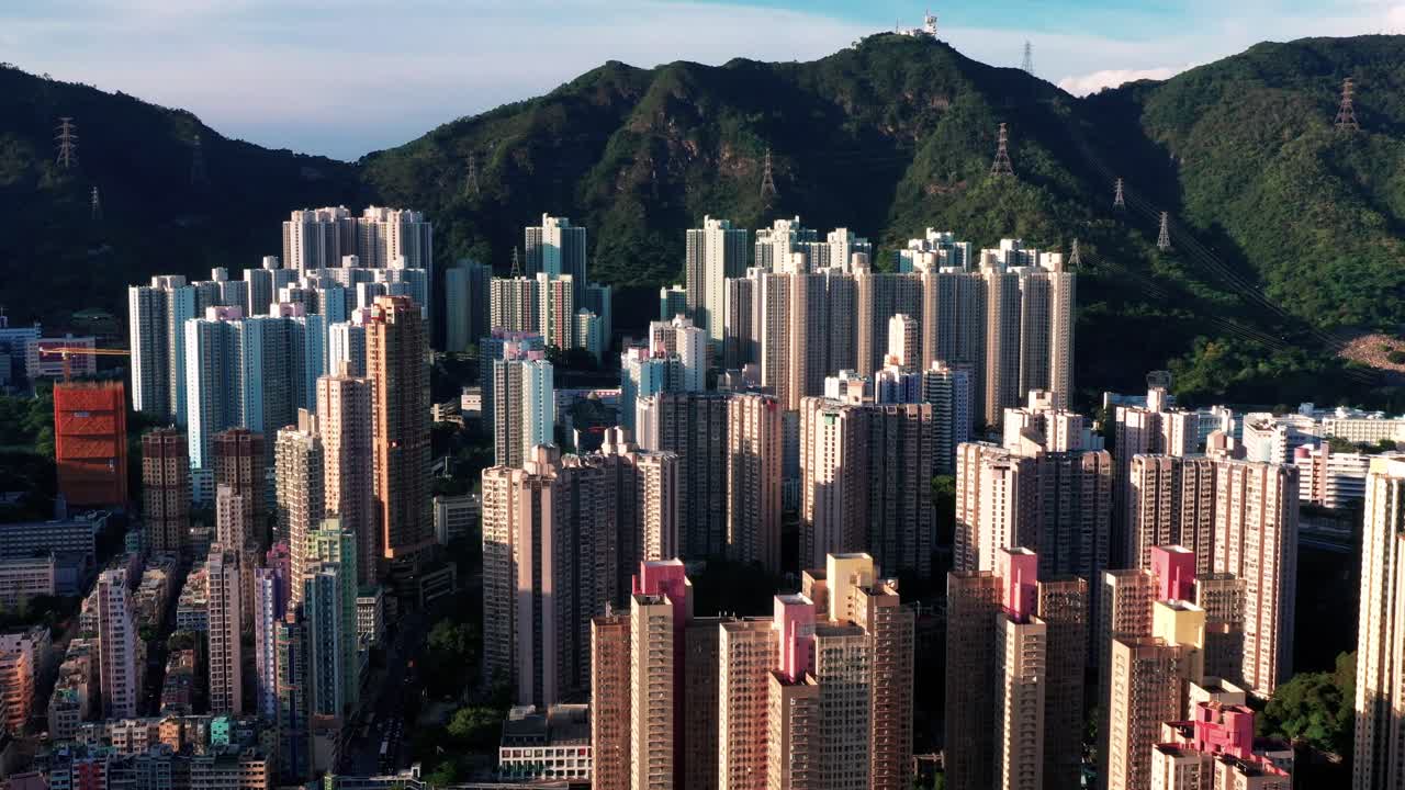 Aerial View of the skyline of Hong Kong at Victoria Harbour Financial Kowloon and Central District.Aerial view of the famous Hong Kong Island. Forward shot flying over office buildings and skyscrapers