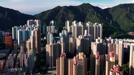aerial view of the skyline of hong kong at victoria harbour financial kowloon and central district.aerial view of the famous hong kong island. forward shot flying over office buildings and skyscrapers
